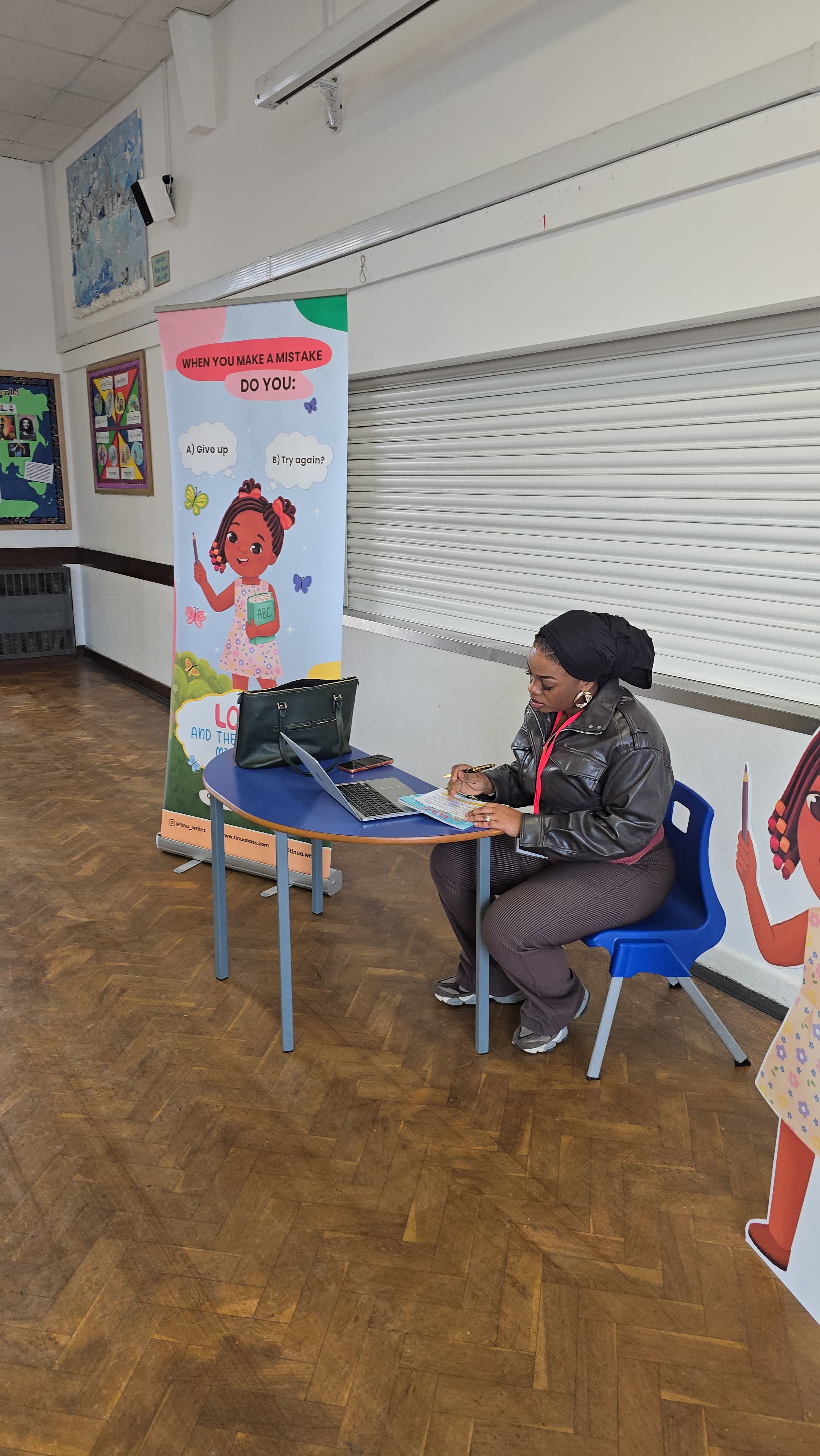 Tinu engaging with children during a school visit